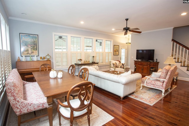 living room with dark wood-type flooring, ceiling fan, and crown molding