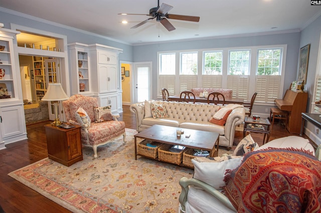 living room with dark wood-type flooring, ceiling fan, crown molding, and plenty of natural light