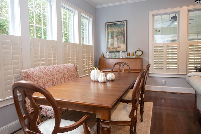 dining room featuring crown molding and dark hardwood / wood-style floors