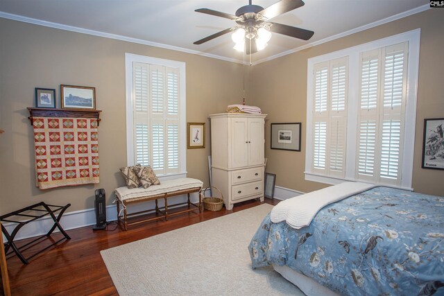 bedroom with ornamental molding, dark hardwood / wood-style floors, and ceiling fan