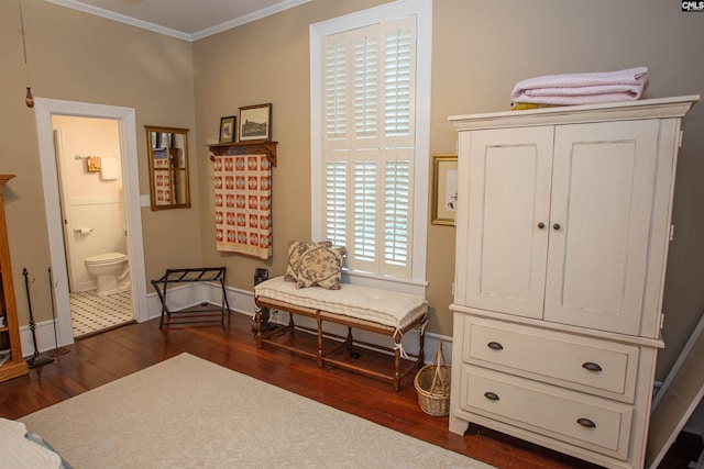 sitting room featuring crown molding and dark wood-type flooring