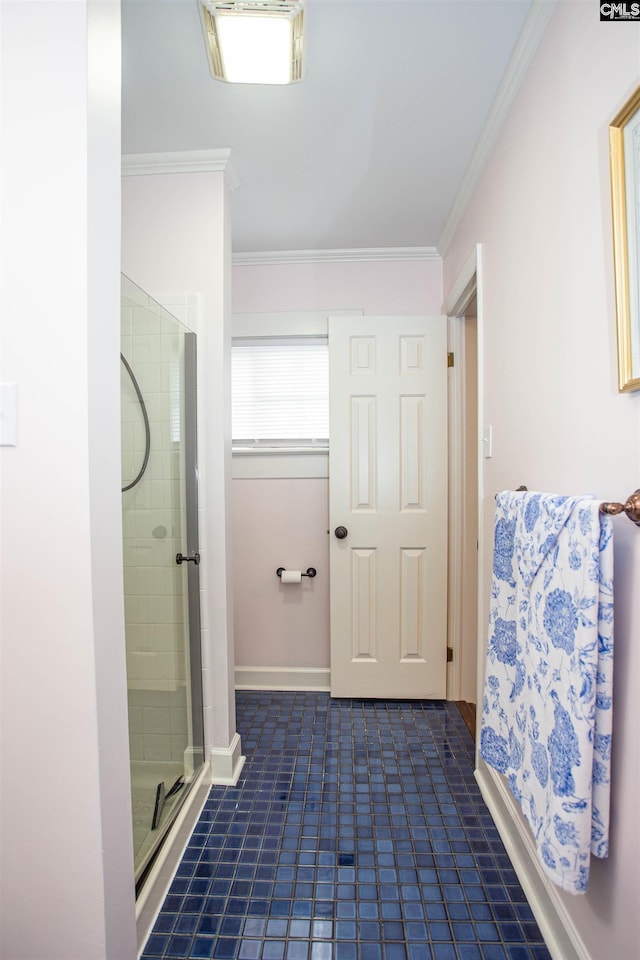 bathroom with ornamental molding, a shower with shower door, and tile patterned flooring