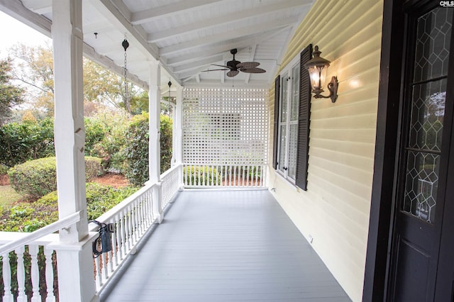 exterior space with a porch and ceiling fan