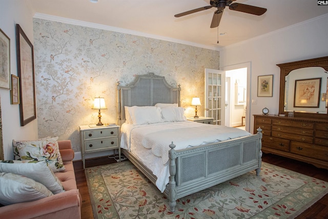 bedroom featuring crown molding, hardwood / wood-style floors, ensuite bath, and ceiling fan