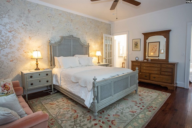 bedroom with ornamental molding, dark hardwood / wood-style floors, and ceiling fan