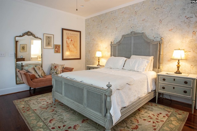 bedroom with ornamental molding and dark hardwood / wood-style floors