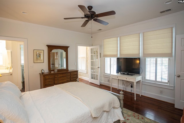 bedroom with ensuite bath, hardwood / wood-style flooring, multiple windows, and ceiling fan