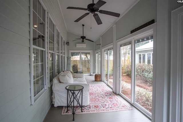 sunroom / solarium featuring lofted ceiling, a healthy amount of sunlight, and ceiling fan