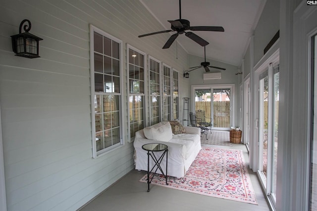 sunroom / solarium with a wall mounted air conditioner, lofted ceiling, and ceiling fan