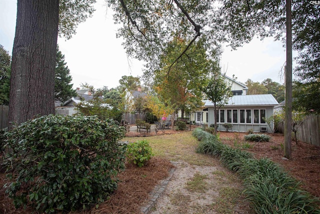 view of yard with a sunroom