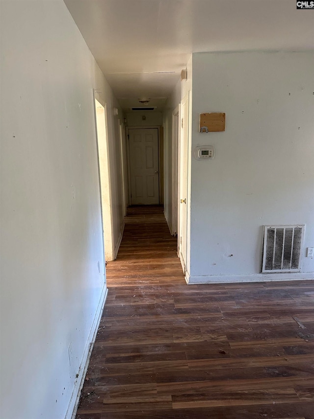 corridor featuring dark wood-type flooring