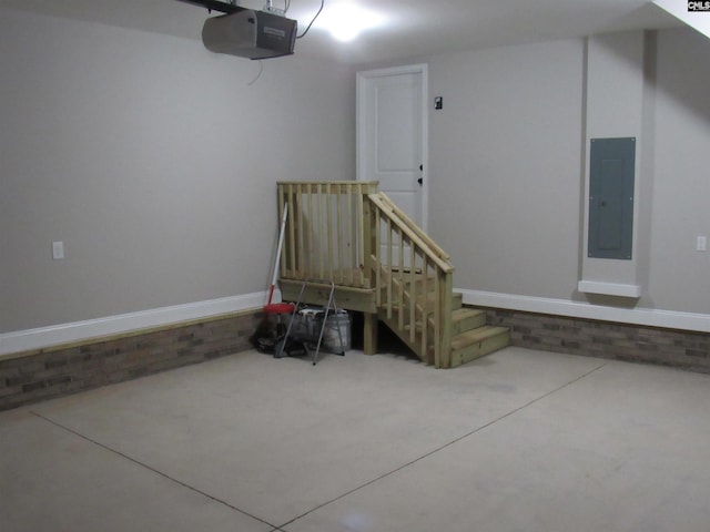 garage featuring a garage door opener and electric panel