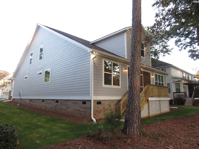 view of home's exterior with a yard