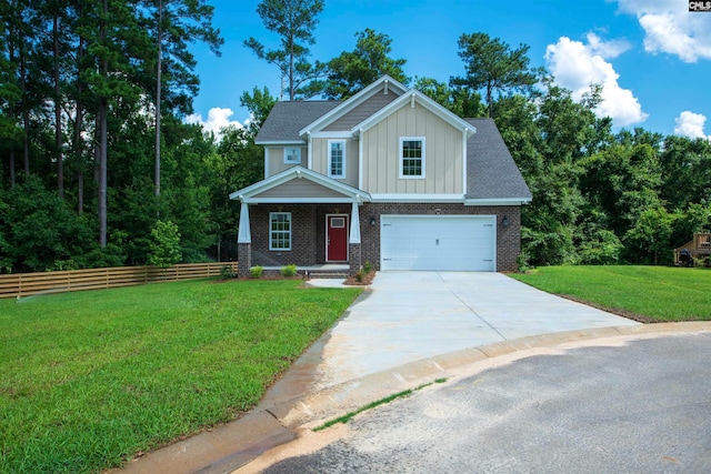 view of front of house featuring a front yard and a garage