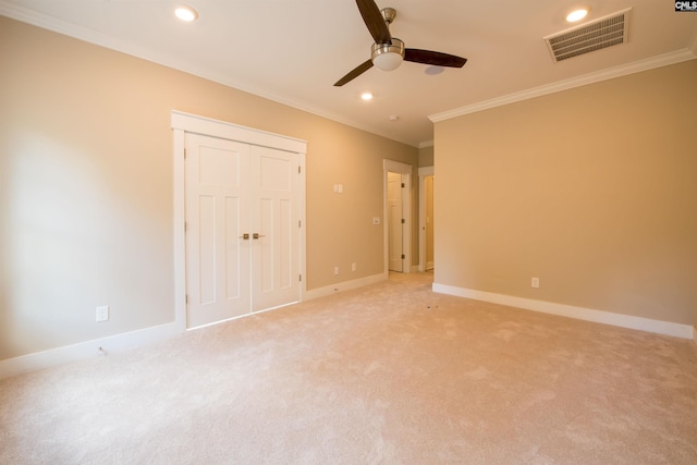 unfurnished bedroom featuring ornamental molding, a closet, and ceiling fan