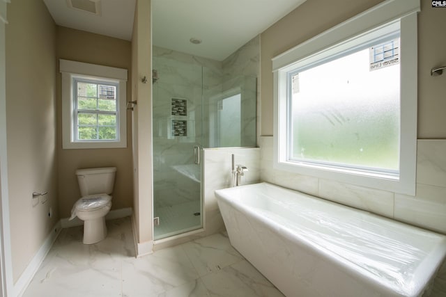 bathroom with toilet, independent shower and bath, and a wealth of natural light