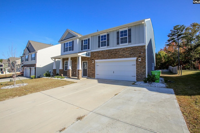 view of front of house featuring a front lawn and a garage