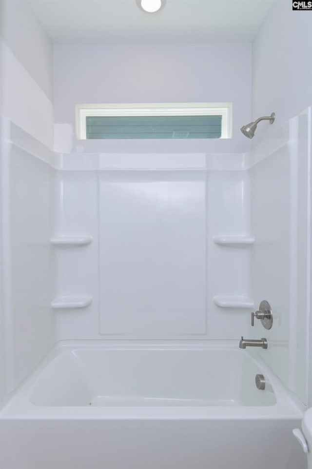 bathroom with shower / bathing tub combination and a wealth of natural light