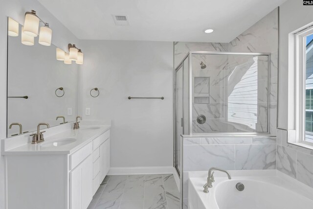 bathroom featuring vanity, a wealth of natural light, and separate shower and tub