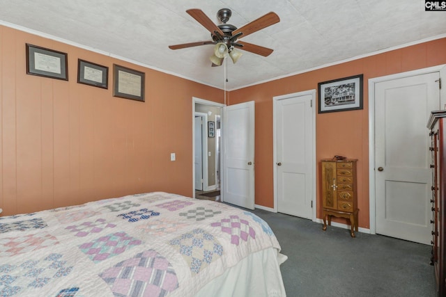 carpeted bedroom with ornamental molding and ceiling fan