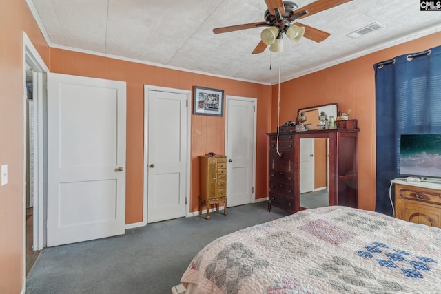 carpeted bedroom featuring ornamental molding and ceiling fan