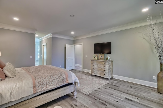 bedroom with ornamental molding and light wood-type flooring