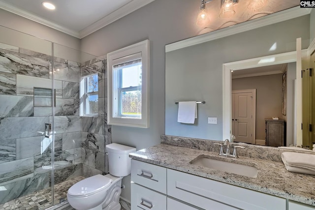 bathroom featuring vanity, toilet, ornamental molding, and an enclosed shower