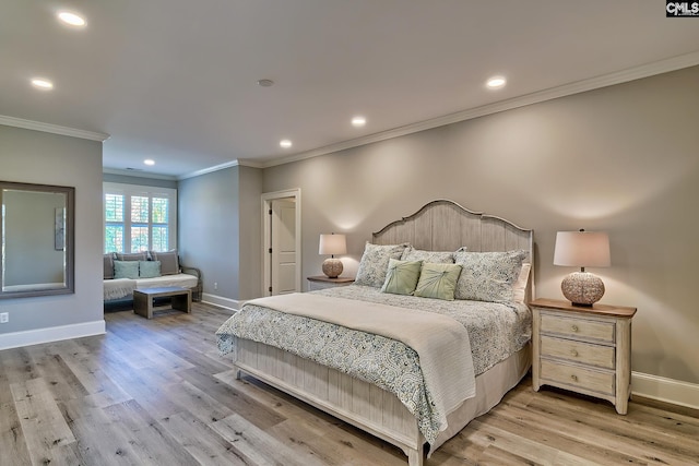 bedroom with light hardwood / wood-style flooring and crown molding