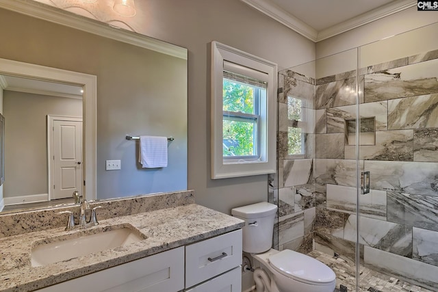 bathroom featuring vanity, ornamental molding, toilet, and walk in shower