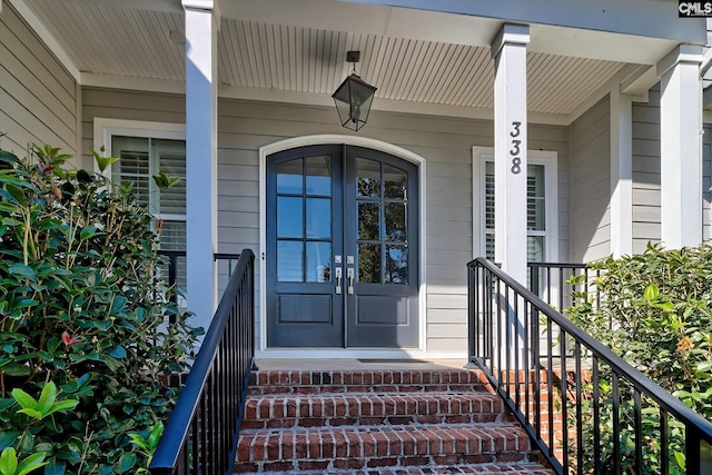 doorway to property featuring covered porch