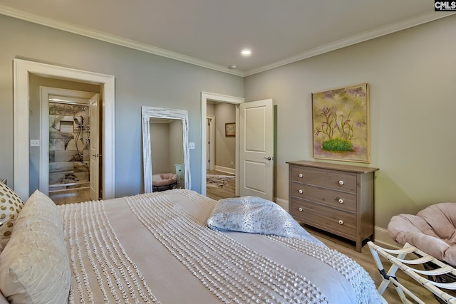 bedroom featuring crown molding and light wood-type flooring