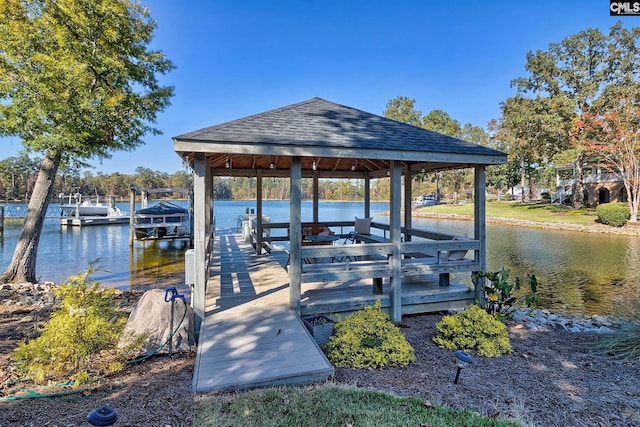 dock area with a gazebo and a water view