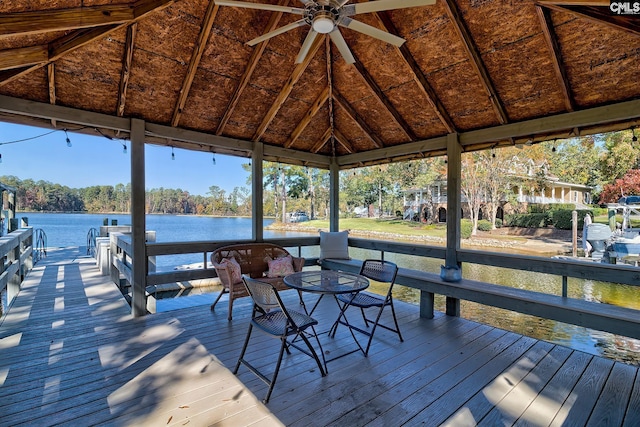 dock area featuring a gazebo and a deck with water view