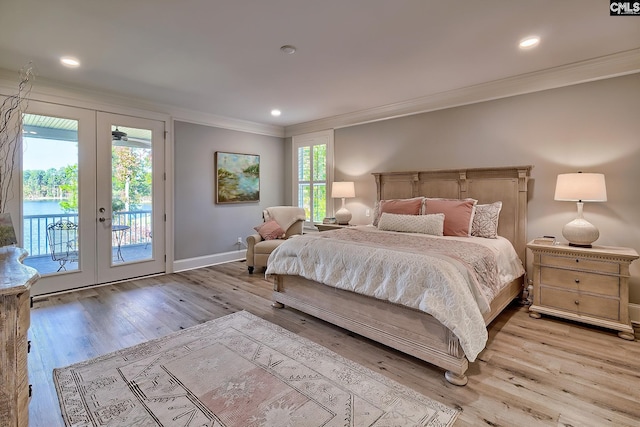 bedroom featuring french doors, multiple windows, access to exterior, and light wood-type flooring