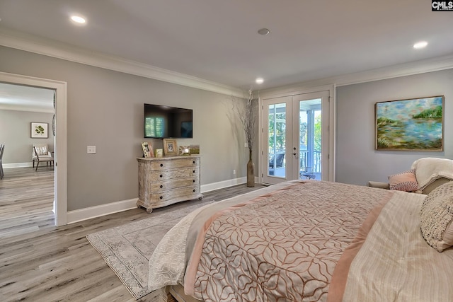 bedroom with hardwood / wood-style floors, crown molding, access to exterior, and french doors