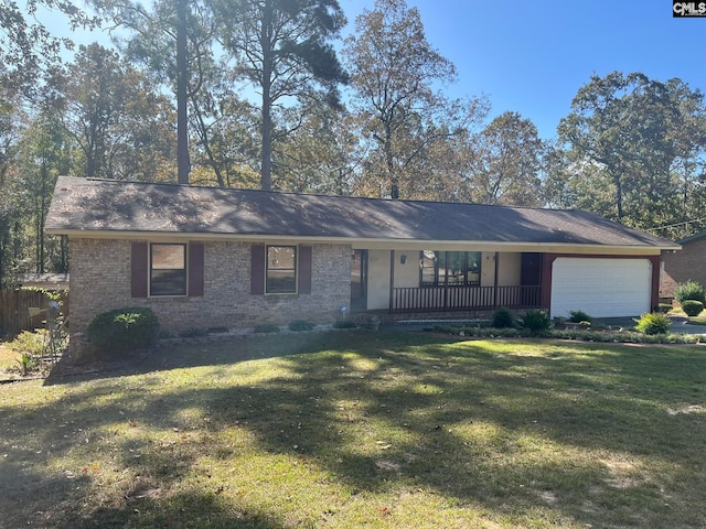 ranch-style home with a front yard, a porch, and a garage