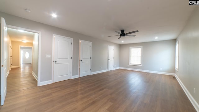 unfurnished room featuring wood-type flooring and ceiling fan