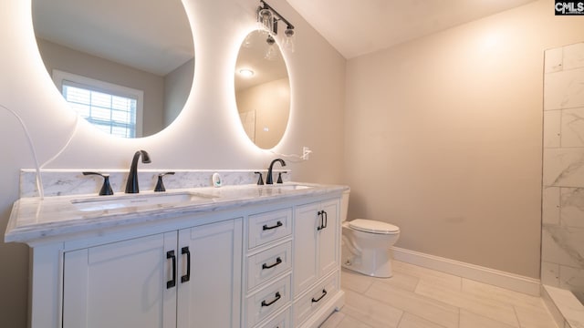101 Dinkins Place Rd, Blythewood, SC 29130 - bathroom with double vanity, toilet, and baseboards