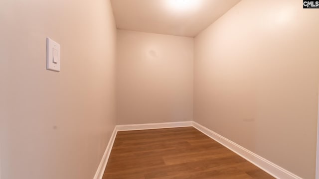 unfurnished room with hardwood / wood-style flooring