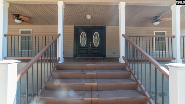 doorway to property featuring ceiling fan and covered porch