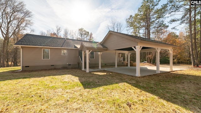 101 Dinkins Place Rd, Blythewood, SC 29130 - back of property featuring crawl space, a patio, a yard, a shingled roof, and a detached carport