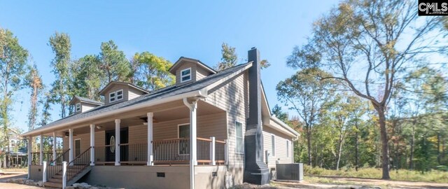 exterior space featuring covered porch, central AC, and ceiling fan