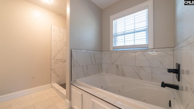 bathroom featuring separate shower and tub