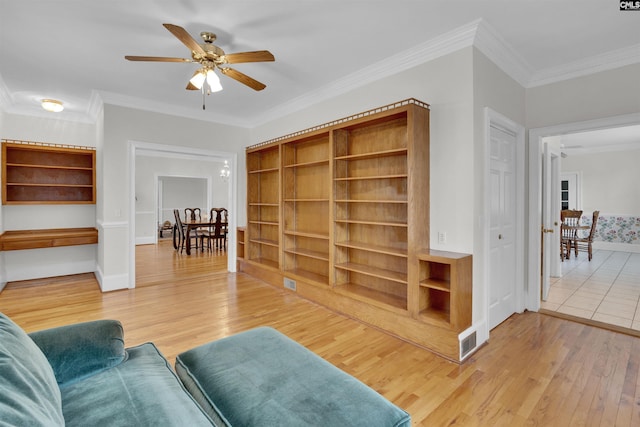 living room featuring ceiling fan, crown molding, and hardwood / wood-style floors