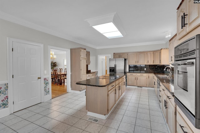 2001 Riding Ridge Rd, Columbia, SC 29223 - kitchen with stainless steel appliances, a kitchen island, light tile patterned floors, a sink, and ornamental molding