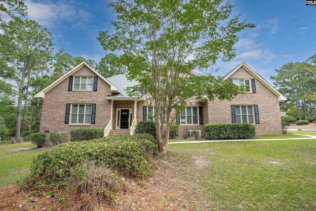 view of front of home with a front yard