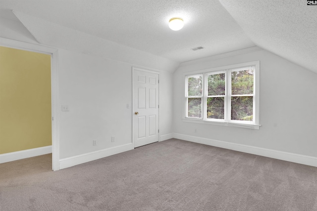 2001 Riding Ridge Rd, Columbia, SC 29223 - additional living space featuring a textured ceiling, vaulted ceiling, carpet flooring, and baseboards