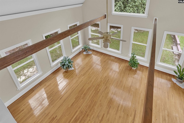 2001 Riding Ridge Rd, Columbia, SC 29223 - unfurnished living room featuring ceiling fan, wood finished floors, a high ceiling, and baseboards