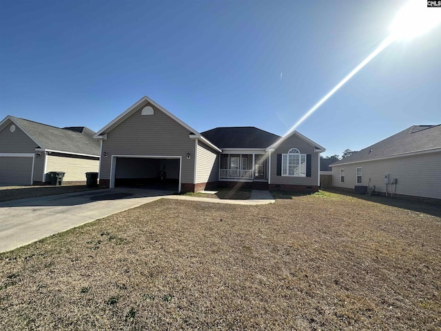 ranch-style house featuring a front yard and a garage