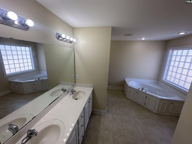 bathroom with vanity and a bathtub